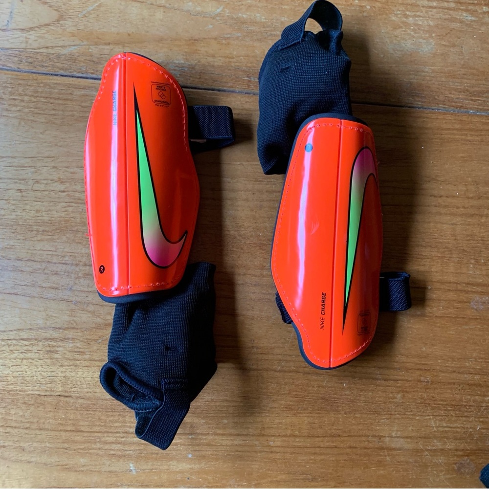 Nike Vibrant Orange Shin Guards with Black Straps